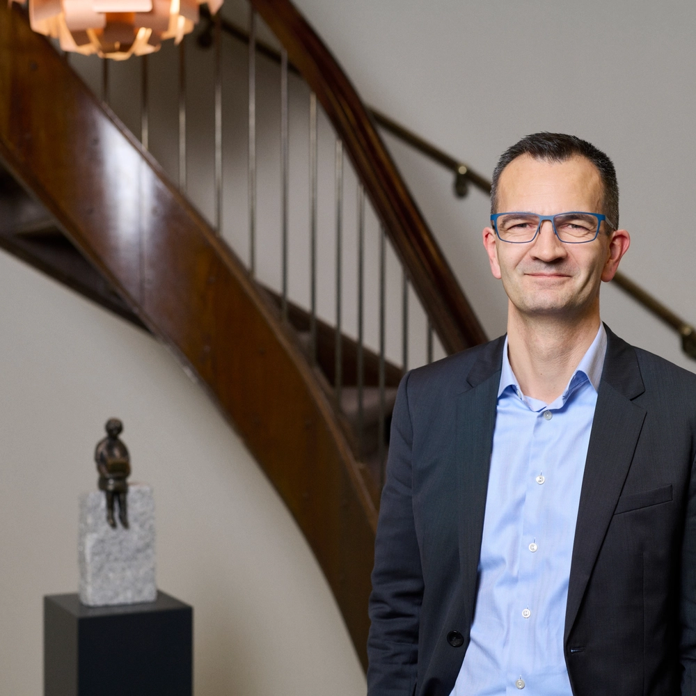 Mikkel Røgild in front of old traditional staircase